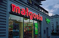 Historyczny neon "Małgosia" znów zdobi plac Wilsona